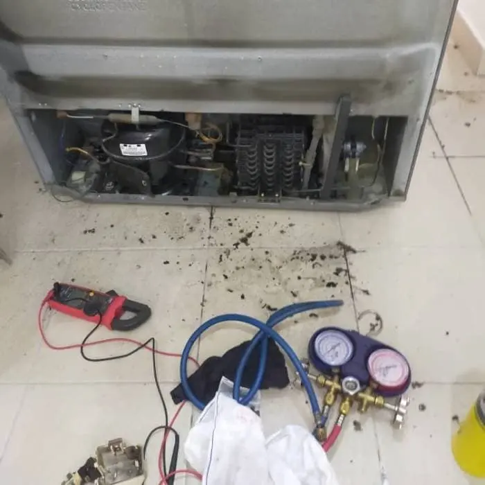 Certified refrigeration repair technicians at work